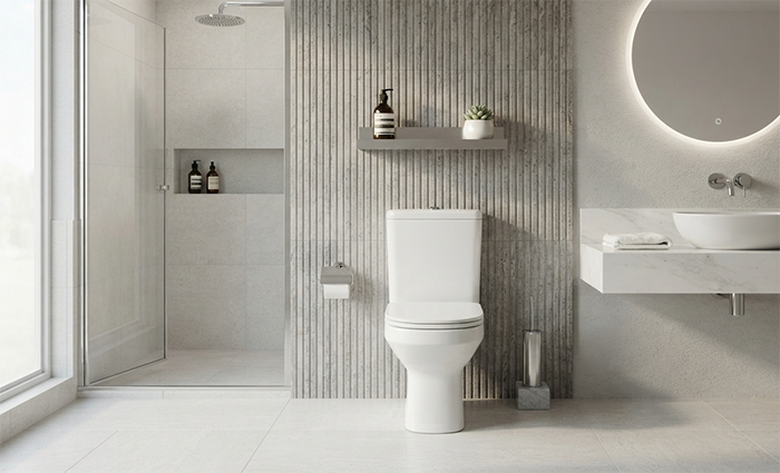 Kit vaso sanitário com caixa acoplada Celite instalado em banheiro moderno com acabamento sofisticado.